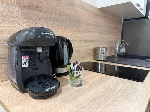 a coffee maker sitting on top of a counter at Studio cozy à Lagnieu in Lagnieu