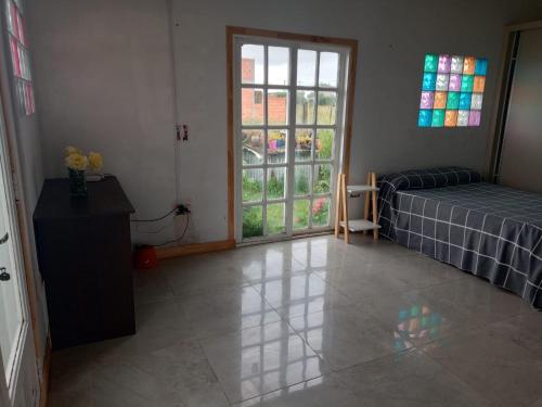 Ένα ή περισσότερα κρεβάτια σε δωμάτιο στο Casa chapadmalal