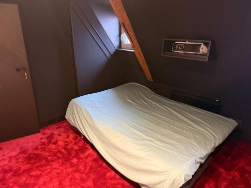 En eller flere senge i et værelse på Le 7e Art Home