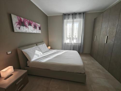 Ένα ή περισσότερα κρεβάτια σε δωμάτιο στο Mavin Apartments Cuneo