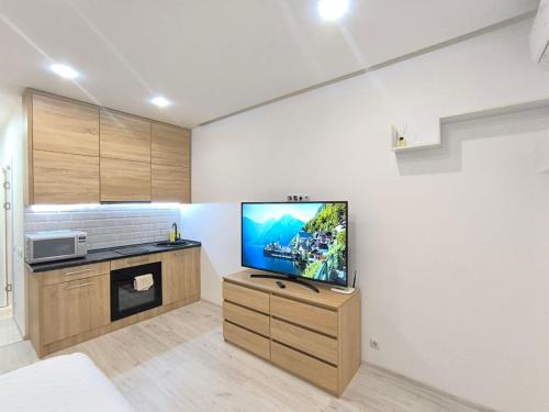 Η κουζίνα ή μικρή κουζίνα στο Смарт квартира в ЖК Комфорт Таун