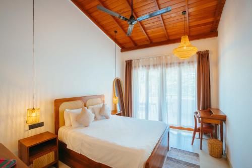 Ένα ή περισσότερα κρεβάτια σε δωμάτιο στο Casa Tharin Madiha