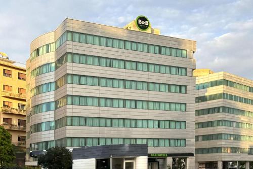 a tall building with a banana on top of it at B&B HOTEL Trapani Crystal in Trapani