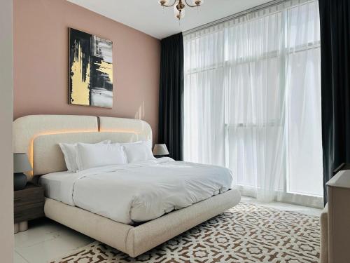 a bedroom with a white bed and a large window at Executive 1BR - Perfect for DIFC & Trade Center in Dubai