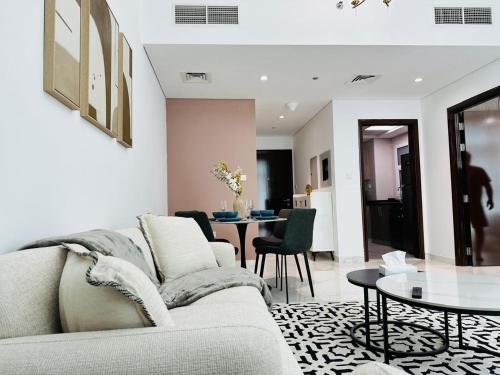a living room with a couch and a table at Executive 1BR - Perfect for DIFC & Trade Center in Dubai