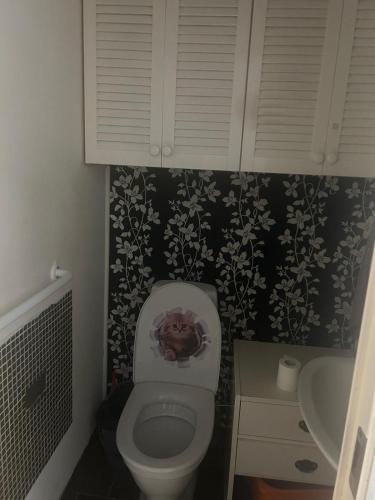 a small bathroom with a toilet and a sink at Sunny ROOM in Stockholm in Stockholm