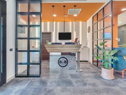 Μια τηλεόραση ή/και κέντρο ψυχαγωγίας στο B&B Hotel Bergamo City