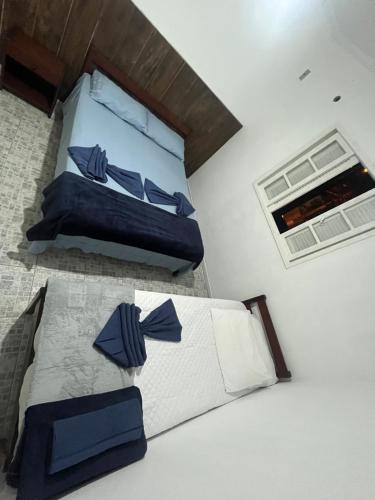 Ένα ή περισσότερα κρεβάτια σε δωμάτιο στο Pousada Canoa Quebrada Ubatuba