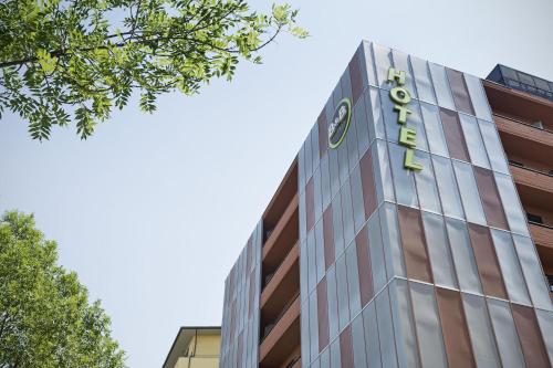a building with a sign on the side of it at B&B Hotel Firenze Nuovo Palazzo Di Giustizia in Florence