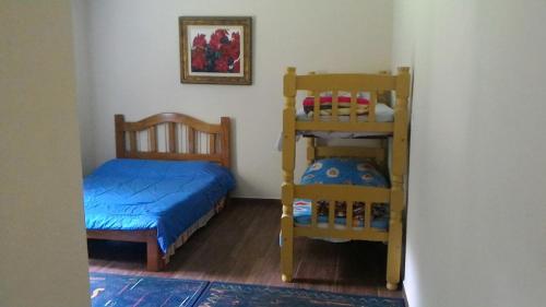 Postel nebo postele na pokoji v ubytování Chacara do Holandes Voador