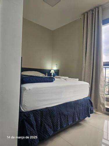 a bedroom with two beds and a window at Studio | Expo Stay Tucuruvi Metro |Swimming pool in São Paulo