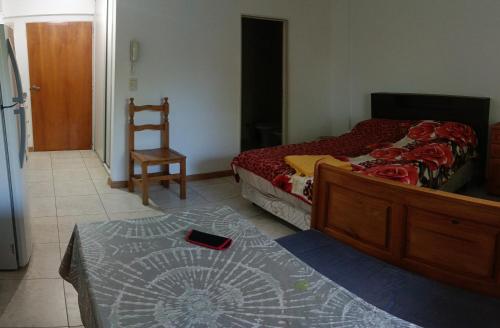 Postel nebo postele na pokoji v ubytování Departamento Ameghino