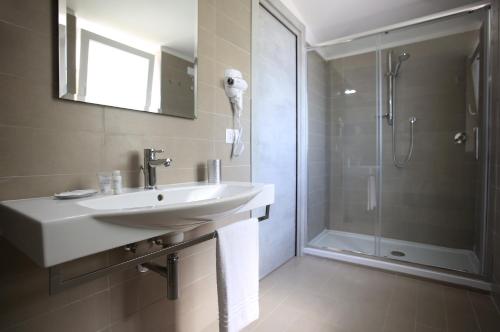 a bathroom with a sink and a shower at Relais Manfredi in Castellammare di Stabia