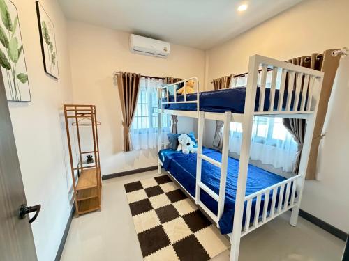 En eller flere senge i et værelse på NeoCasa,Lanna vibe-live local life