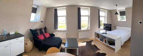 Ένα ή περισσότερα κρεβάτια σε δωμάτιο στο Zeeziek