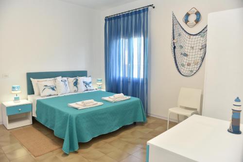 A bed or beds in a room at Giglio Selvatico Apartment