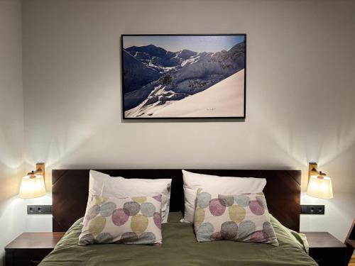 a bedroom with a bed and a snow covered mountain at Ski-in Flat Next to Ski Road at Mountain View in Bansko