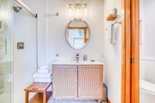 a bathroom with a sink and a mirror at Sunshine and Sweaters in Pacific City