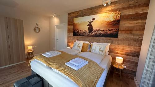 En eller flere senge i et værelse på Landhaus Vorderberg - Appartementen