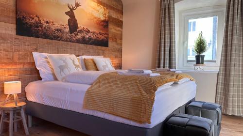 En eller flere senge i et værelse på Landhaus Vorderberg - Appartementen