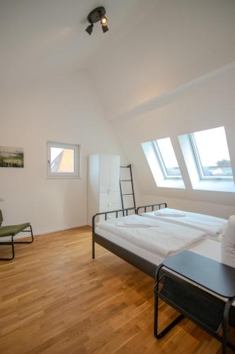 Ένα ή περισσότερα κρεβάτια σε δωμάτιο στο betterplaces Homes - Frontenhausen