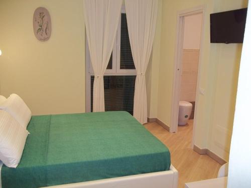 Katil atau katil-katil dalam bilik di Guest House Le Tre Spezie