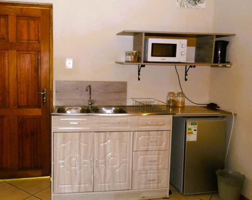 Η κουζίνα ή μικρή κουζίνα στο Garden Wing