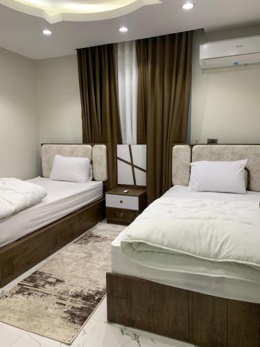 Ένα ή περισσότερα κρεβάτια σε δωμάτιο στο Aparthotel