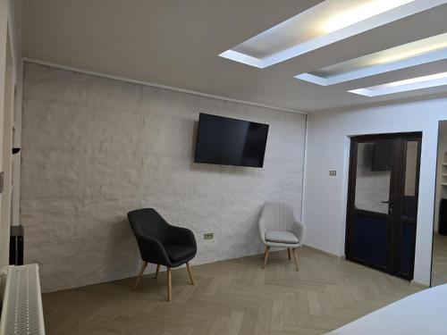 TV a/nebo společenská místnost v ubytování LuxInn