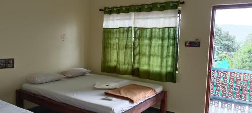 Ένα ή περισσότερα κρεβάτια σε δωμάτιο στο Unicorn Resort