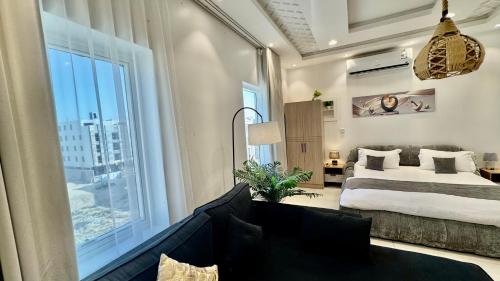 Ένα ή περισσότερα κρεβάτια σε δωμάτιο στο استديو بوصول ذاتي غرفتين