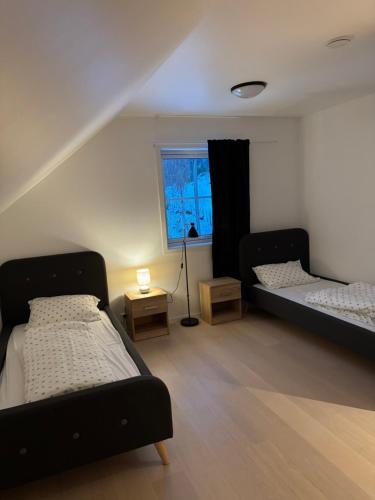 En eller flere senge i et værelse på Villa