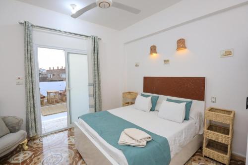 Ένα ή περισσότερα κρεβάτια σε δωμάτιο στο Akhet House