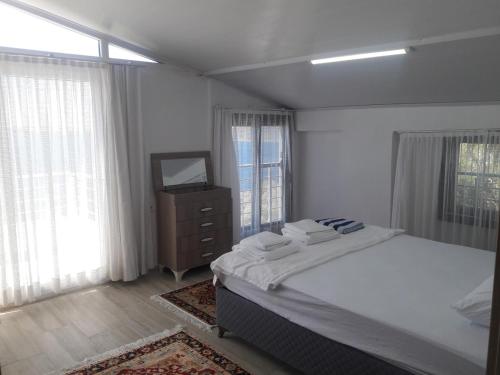 Postel nebo postele na pokoji v ubytování SUBÜŞAH Suit Apart Konaklama