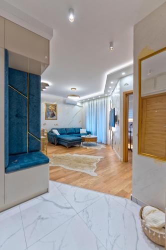 a living room with a blue couch and a blue sofa at Queen Lidija in Zlatibor
