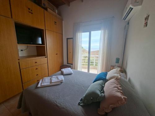 En eller flere senge i et værelse på Tranquilo duplex frente al mar