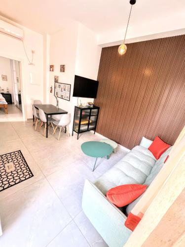 a living room with a couch and a table at Up the Hill in Tiberias