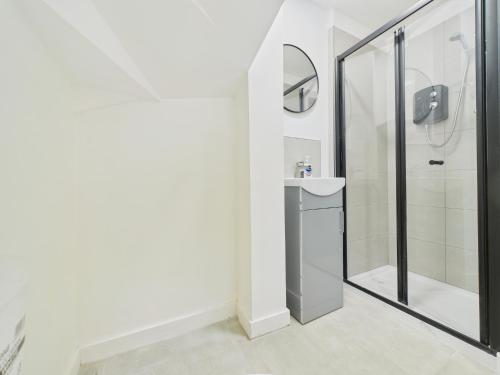 a bathroom with a shower and a sink at Green Hat Stays Newport City in Newport