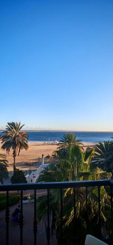 a view of a beach with palm trees and the ocean at marina1 in Agadir