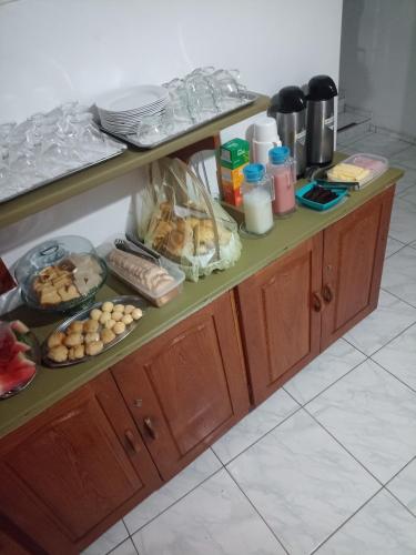 a counter with food on top of it at Pousada Jatobá in Barreirinhas