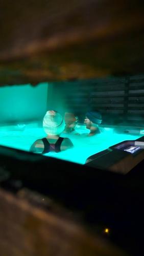 a table with three vases on top of it at Kataja Chalet with sauna and jacuzzi in Rovaniemi