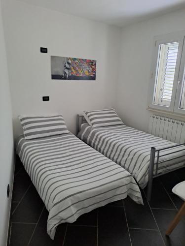 Postel nebo postele na pokoji v ubytování Casa gialla