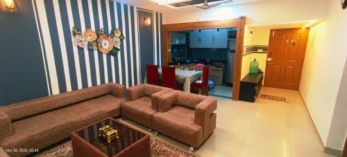 a living room with a couch and a table at GK appartments in Bengaluru