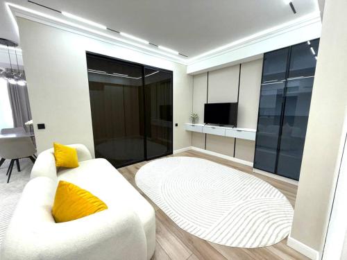 Μια τηλεόραση ή/και κέντρο ψυχαγωγίας στο Красивая трёхкомнатная квартира