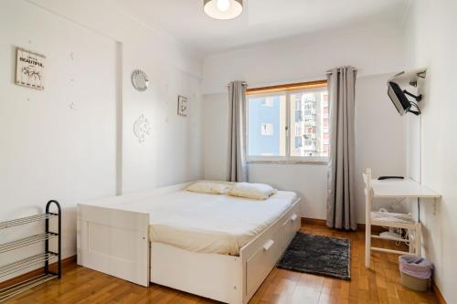 Ένα ή περισσότερα κρεβάτια σε δωμάτιο στο Apartamento para 6 hóspedes em Queluz próximo Lisboa,Sintra e Cascais