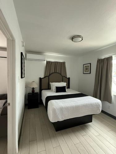 a bedroom with a large bed in a room at Holiday Isles Resort in St. Pete Beach
