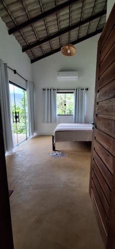 En eller flere senge i et værelse på Casa Mirante da Serra