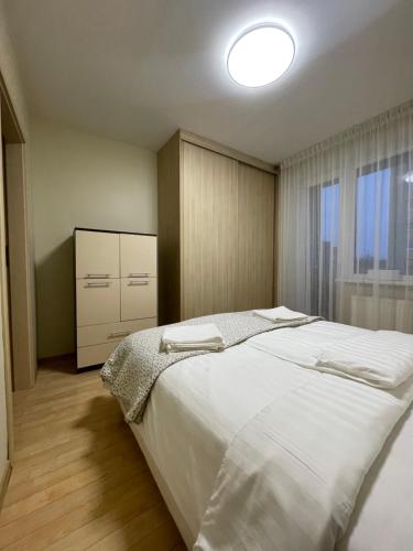 Giường trong phòng chung tại Silver Vytauto Apartments