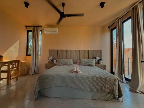 a bedroom with a bed with a towel on it at Casa Melon 1BR Spectacular Private Oceanview Terrace in Santa María Colotepec