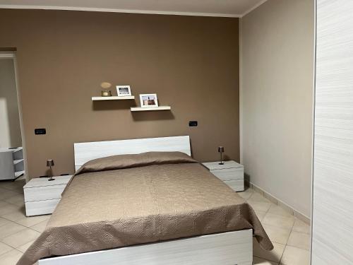 Ένα ή περισσότερα κρεβάτια σε δωμάτιο στο Appartamenti Castel Ritaldi Il Sagrantino